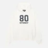 Front view of the '80 Relaxed Hoodie' in offwhite, featuring a relaxed fit and soft fabric.