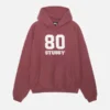 Front view of the 80 Relaxed Hoodie in deep oxblood color, featuring a comfortable oversized fit and minimalist design.