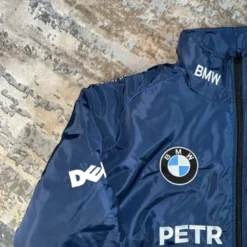 Right close-up view of the BMW Sauber Navy Jacket, showcasing design details and fabric texture.