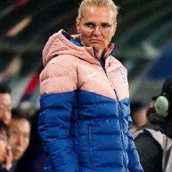 Side view of the England Lionesses Puffer Jacket, highlighting its sleek fit and premium insulation.