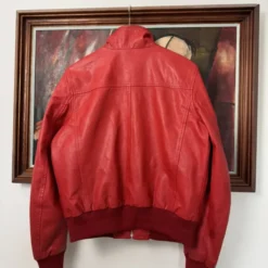 Back view of Ferrari Leather Y2K Hype Racing Jacket showcasing iconic Ferrari branding and racing-inspired details.