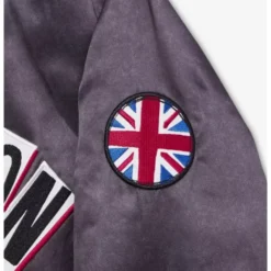 Close-up view of the sleeve details on the Across the Spider-Verse New London Satin Jacket, showcasing the fabric texture and stitching.