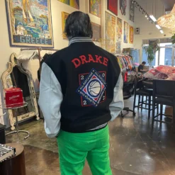 Jeff Hamilton x Drake Rap Caviar Jacket - Back View featuring intricate embroidery, bold lettering, and a tribute to rap legends.