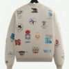 Kith Olympics Heritage Marvin Bomber Jacket back view displaying multiple embroidered Olympic logos across a vintage-inspired off-white fabric.