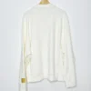 Kith Olympics Heritage Nelson Collared Pullover back view in off-white with a clean, minimalist design and a gold Olympic patch on the sleeve.