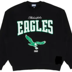 Kith X NFL Philadelphia Eagles Nelson Crewneck in black with bold 'Eagles' text and flying eagle graphic on the chest.
