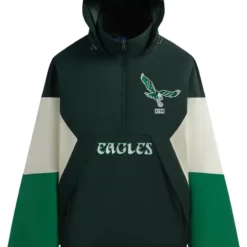 Kith x NFL Philadelphia Eagles Quarter Zip Anorak in dark green with cream and green sleeve panels, featuring an embroidered Eagles logo and Kith branding.