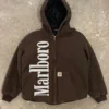 Vintage brown Marlboro Carhartt jacket with a hood, zip-up front, ribbed cuffs, and bold white Marlboro branding on the left side.