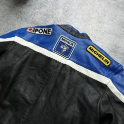 Close-up of the back of the Marlboro x Lucky Strike F1 Racing Leather Jacket, showcasing detailed embroidery and racing graphics.