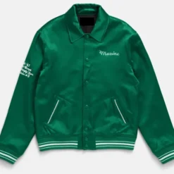 Mia Goth MaXXXine green satin jacket front view with "Maxine" embroidery.