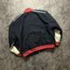 Michael Schumacher Ferrari Racing Jacket back view - navy blue with red and white accents, showcasing a sleek racing-inspired design.
