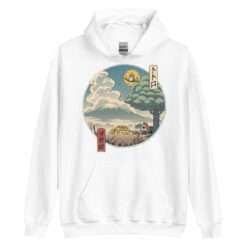 A white hoodie featuring a My Neighbor Totoro design inspired by traditional Japanese art, with a circular illustration of a scenic countryside, Mount Fuji, and a Catbus under a large tree.