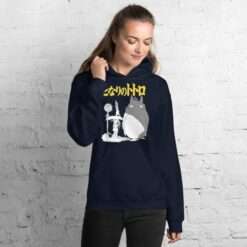 A navy blue hoodie featuring a My Neighbor Totoro design with Totoro standing at a bus stop, accompanied by Japanese text in yellow.