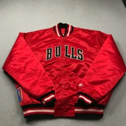 NBA 90s Chicago Bulls red satin bomber jacket with button closure and embroidered team logo.