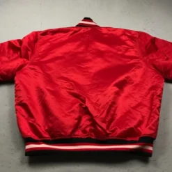 Back view of NBA 90s Chicago Bulls red satin bomber jacket with a smooth finish and ribbed hem.