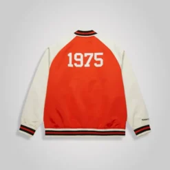Back view of the NHL Philadelphia Flyers Orange Varsity Jacket with a large "1975" print and contrast sleeves.