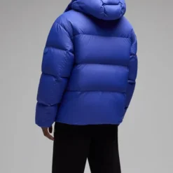 Back view of the OVO Bounce Jacket in blue, showcasing quilted puffer design and hood.