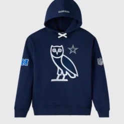 A navy blue OVO Dallas Cowboys Icon Team Hoodie featuring the OVO owl logo and Dallas Cowboys star on the chest, with NFC and NFL patches on the sleeves.