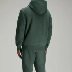 Back view of the OVO Icon Speckle Hoodie in green.