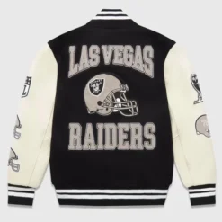 OVO Las Vegas Raiders Varsity Jacket with bold "Las Vegas Raiders" lettering, helmet embroidery, and varsity-style detailing.