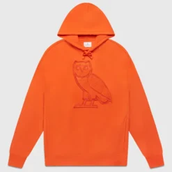 "Front view of the OVO Summer OG Hoodie in vibrant orange, featuring an embroidered owl logo on the chest and lace-up hood detail.