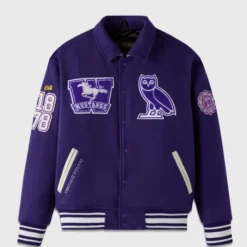 Purple OVO x Western Campus Varsity Jacket front view with embroidered Western Mustangs logo, OVO owl, and "1878" patch.