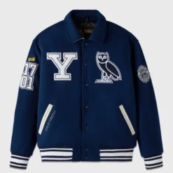OVO x Yale Campus Varsity Jacket in navy blue with embroidered Yale "Y" logo, OVO owl, and founding year details.