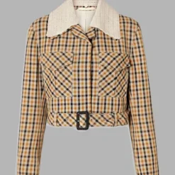 Selena Gomez wearing a plaid jacket with a textured white collar in Only Murders in the Building Season 3.