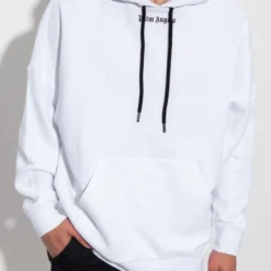A white Palm Angels cotton hoodie with a minimalist logo on the chest and black drawstrings.