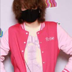 A person wearing the Ranboo Barbie Jacket, a vibrant pink and white varsity-style jacket with "Barbie" embroidered on the chest.