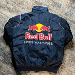 Red Bull F1 Racing Jacket Back View with Logo and "Gives You Wings" Slogan