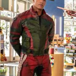 Dwayne Johnson wearing the Red One 2024 leather jacket, standing confidently in a toy store.