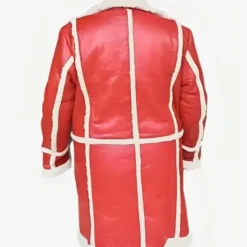 The back view of a red leather Santa Claus coat with white shearling trim, showcasing structured paneling and festive detailing.