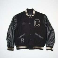 Black varsity jacket with leather sleeves, embroidered "C" patch, and striped ribbed cuffs.