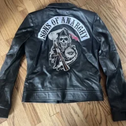 Back view of the Sons of Anarchy Charlie Hunnam Leather Jacket, showcasing the iconic Grim Reaper logo and Sons of Anarchy text patch on the back.