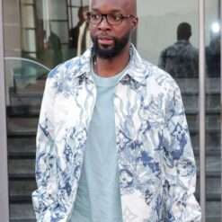 Lassana Diarra sports a printed jacket during a football match, featuring dynamic designs and bold graphics that reflect his energetic style both on and off the field.