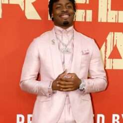 Malaki Starks 2025 NFL Draft Red Carpet Lambeau Field Light Pink Blazer April 24 Pink Blazer, a stylish light pink blazer worn by Malaki Starks at the 2025 NFL Draft red carpet event.