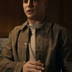 Miguel Alfaro in SWAT Season 8 wears a stylish suede trucker jacket, featuring a classic design with a rugged, soft texture, adding a touch of casual flair to his tactical look.