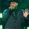Darius J on The Voice Season 27 wears a sleek pinstriped blazer, combining classic tailoring with a modern twist for a sophisticated and sharp look.