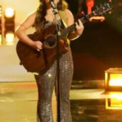 Lucia Flore Wisemans on The Voice Season 27 dazzles in a sequin jumpsuit, featuring shimmering sequins that catch the light, creating a glamorous and bold stage presence.