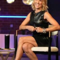 Sheryl Crow on The Voice Season 27 rocks a studded leather dress, blending edgy style with sophistication, featuring bold studs and a sleek, form-fitting silhouette.