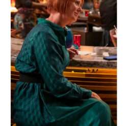 Cynthia Nixon wearing a green jacquard long belted shirt dress from And Just Like That – elegant women's dress with textured fabric, button-down front, and waist-cinching belt.