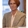 Cynthia Nixon wearing a striped blazer from And Just Like That Season 3 – tailored women's jacket with vertical stripes, structured fit, and smart-casual style.