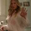 Sarah Jessica Parker in striped pajama set from And Just Like That – relaxed-fit sleepwear with classic stripe pattern, button-up top, and matching pants.