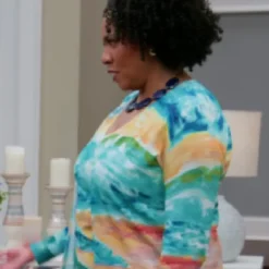 Teacher wearing a colorful tie-dye top in House of Payne Season 14 – vibrant pattern with casual, comfortable fit.