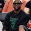 Kevin Hart attends a Los Angeles Clippers game wearing a black sweatshirt, showcasing a relaxed and casual look with a sporty edge perfect for courtside style.