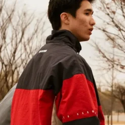 Qt8 Garments red and black track jacket – sporty zip-up with color-block design and lightweight fabric.