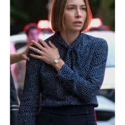 Jessica Biel in a polka dot tie-bow blouse from The Better Sister – elegant women's top featuring a bow-tie neckline, soft fabric, and classic polka dot print.