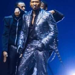 Usher dazzles at his Berlin concert in 2025, wearing a sequin suit that sparkles under the lights, adding a bold and glamorous touch to his dynamic stage presence.
