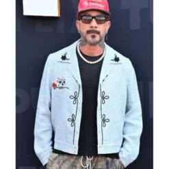 AJ McLean wearing a blue jacket with skull print from Tudum 2025 – edgy men's outerwear featuring bold skull graphics, zip-up front, and a modern fit.